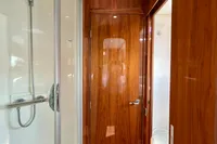 Luxurious wooden interior of 2010 Privilege 515 yacht with modern shower.