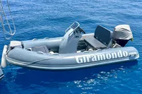 Inflatable boat "Giramondo" on blue water, Privilege 515, 2010 model.