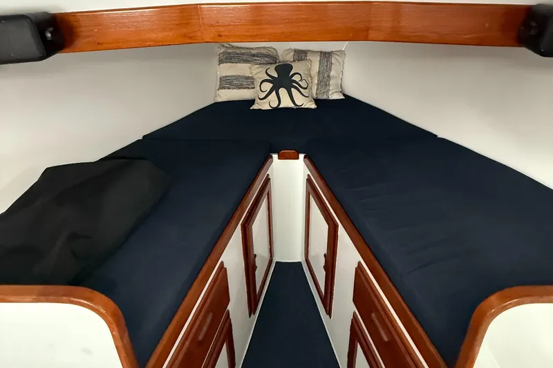 Salty Dog Yacht Photos Pics Cozy cabin interior of 1993 Young Brothers 38 boat with octopus pillow.