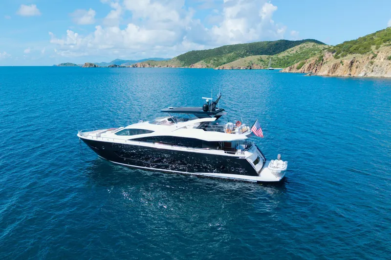  Yacht Photos Pics 2017 Sunseeker 86 Yacht cruising in clear blue waters near scenic coastline.