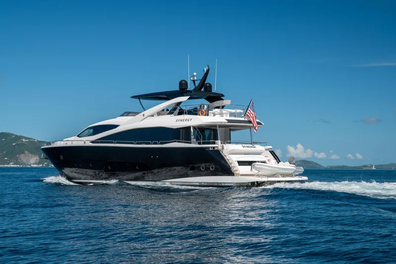  Yacht Photos Pics 2017 Sunseeker 86 Yacht cruising on open water under clear blue skies.