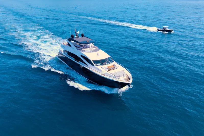  Yacht Photos Pics 2017 Sunseeker 86 Yacht cruising on open blue sea, aerial view.