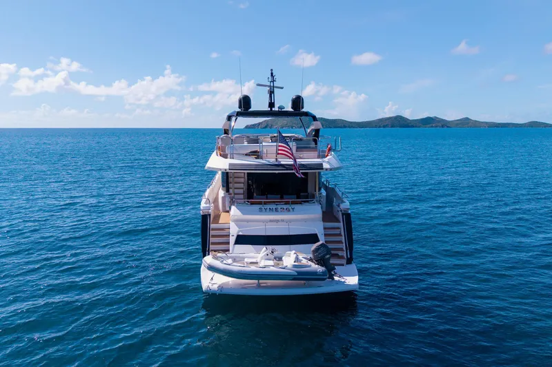  Yacht Photos Pics 2017 Sunseeker 86 Yacht on open sea, rear view with clear skies.