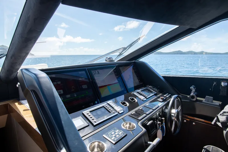  Yacht Photos Pics Cockpit of 2017 Sunseeker 86 Yacht with navigation screens and ocean view.