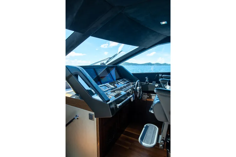  Yacht Photos Pics Luxurious helm of 2017 Sunseeker 86 Yacht with advanced navigation controls.
