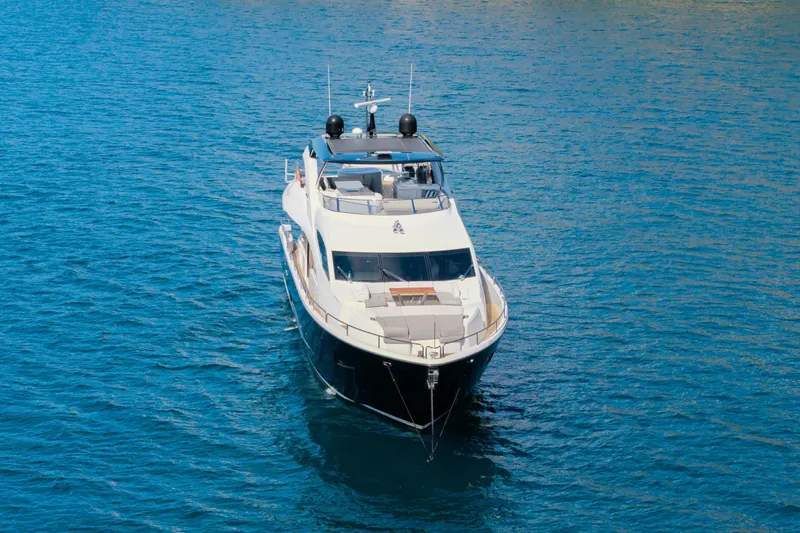  Yacht Photos Pics 2017 Sunseeker 86 Yacht cruising on clear blue water.