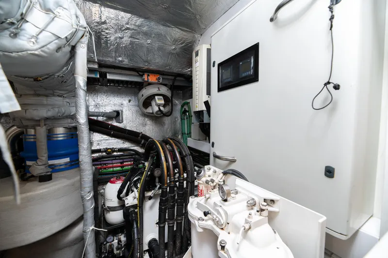  Yacht Photos Pics Engine room of 2017 Sunseeker 86 Yacht, showcasing mechanical components and control systems.
