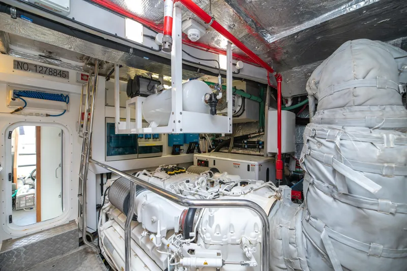  Yacht Photos Pics Engine room of a 2017 Sunseeker 86 Yacht, showcasing machinery and equipment.