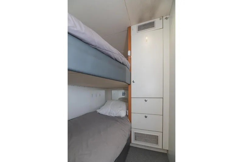  Yacht Photos Pics Bunk beds in 2017 Sunseeker 86 Yacht cabin with storage cabinet.