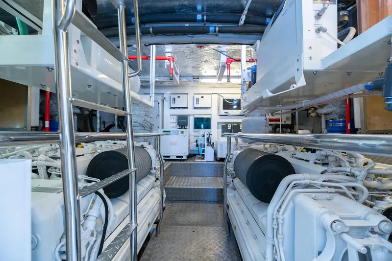  Yacht Photos Pics Engine room of a 2017 Sunseeker 86 Yacht, showcasing machinery and equipment.