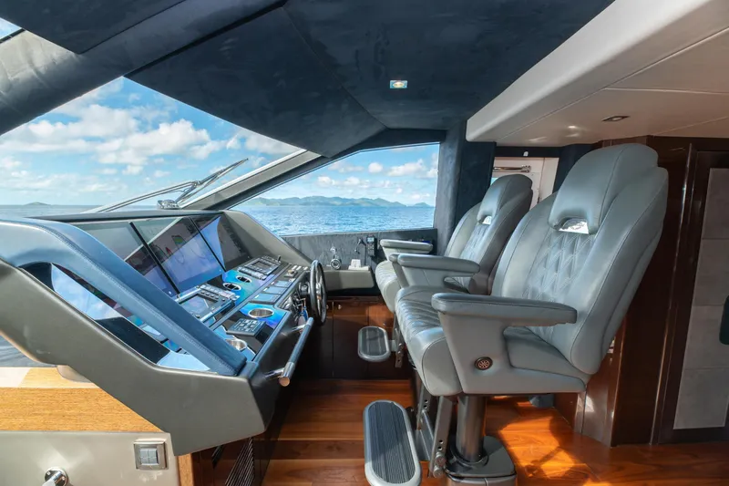  Yacht Photos Pics Luxurious helm of 2017 Sunseeker 86 Yacht with modern controls and ocean view.