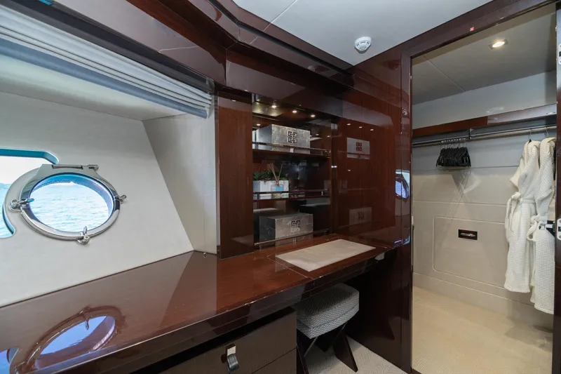  Yacht Photos Pics Luxurious interior of 2017 Sunseeker 86 Yacht with elegant wood finishes and ocean view.