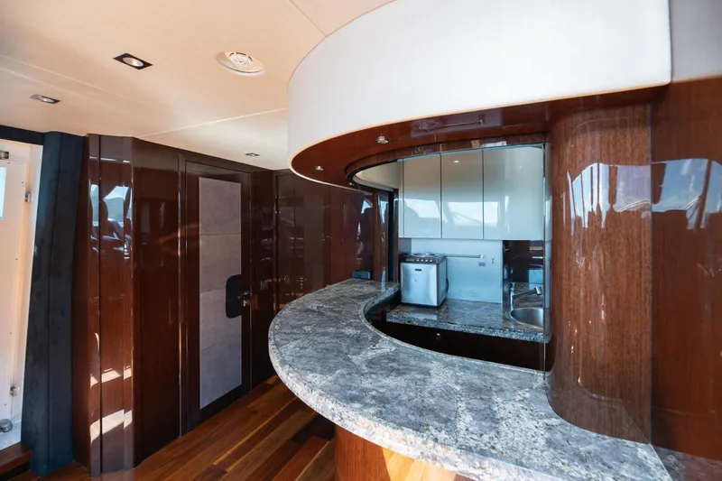 Yacht Photos Pics Luxurious interior of 2017 Sunseeker 86 Yacht with elegant wood and granite finishes.