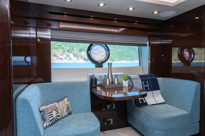  Yacht Photos Pics Luxurious interior of 2017 Sunseeker 86 Yacht with elegant seating and scenic window view.