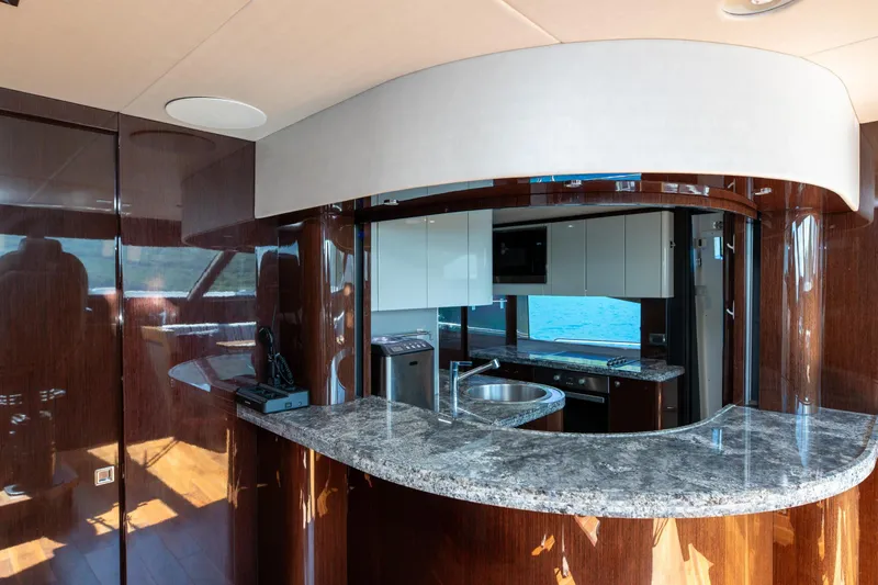  Yacht Photos Pics Luxurious kitchen interior of 2017 Sunseeker 86 Yacht with modern design and ocean view.