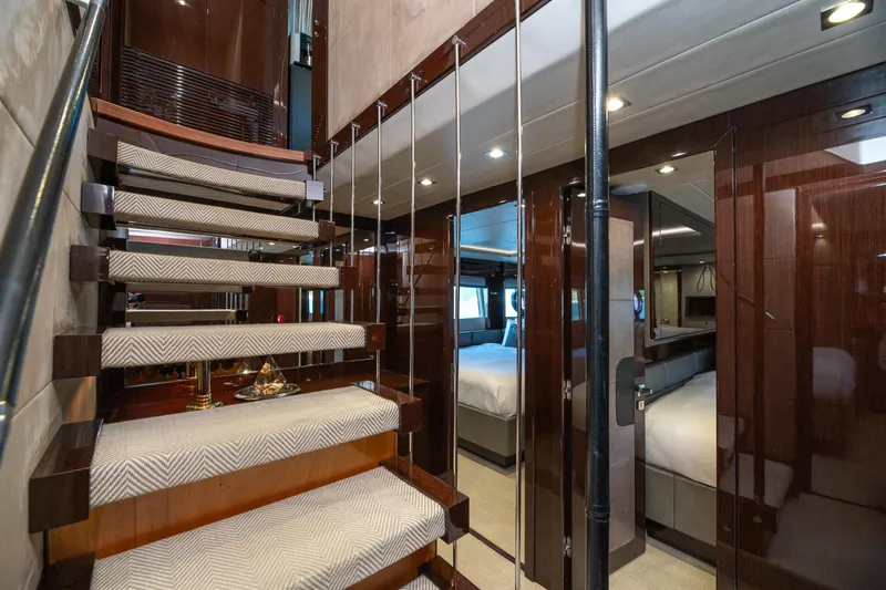  Yacht Photos Pics Luxurious interior of 2017 Sunseeker 86 Yacht with elegant staircase and modern design.
