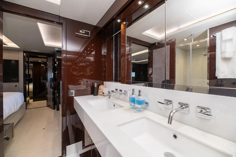  Yacht Photos Pics Luxurious bathroom interior on 2017 Sunseeker 86 Yacht, featuring dual sinks and modern fixtures.