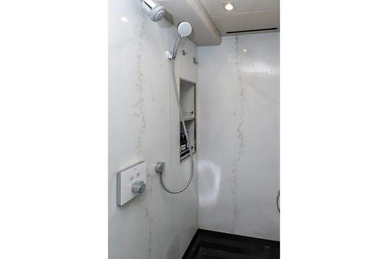  Yacht Photos Pics Luxurious shower area in 2017 Sunseeker 86 Yacht with modern fixtures.