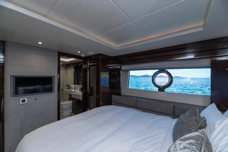  Yacht Photos Pics Luxurious bedroom interior of 2017 Sunseeker 86 Yacht with ocean view.