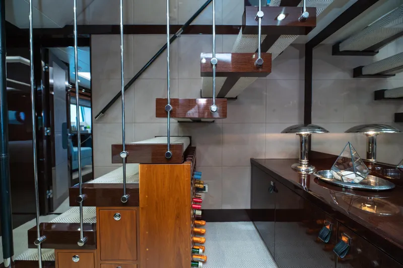  Yacht Photos Pics Luxurious interior of 2017 Sunseeker 86 Yacht with modern staircase and elegant decor.