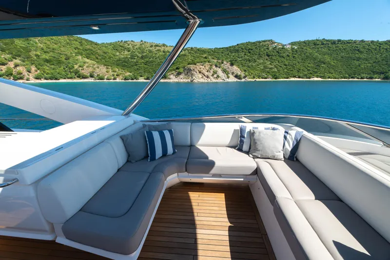  Yacht Photos Pics Luxurious Sunseeker 86 Yacht 2017 with elegant seating, overlooking serene blue waters and lush coastline.