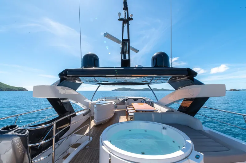  Yacht Photos Pics Luxurious 2017 Sunseeker 86 Yacht with jacuzzi, cruising in serene blue waters.