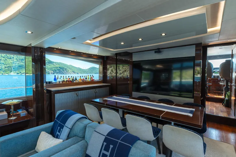  Yacht Photos Pics Luxurious interior of 2017 Sunseeker 86 Yacht with large TV and scenic window view.
