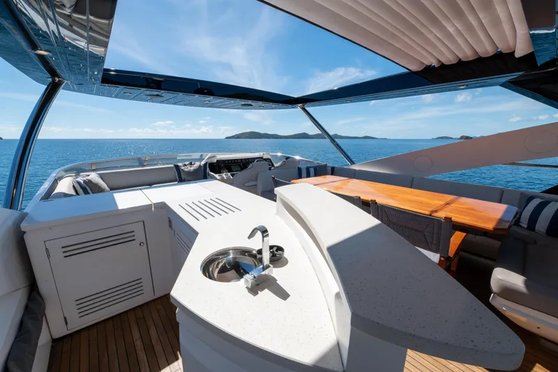  Yacht Photos Pics Luxurious 2017 Sunseeker 86 Yacht deck with seating, sink, and ocean view.