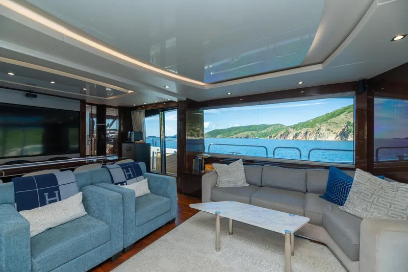  Yacht Photos Pics Luxurious interior of 2017 Sunseeker 86 Yacht with ocean view through large windows.