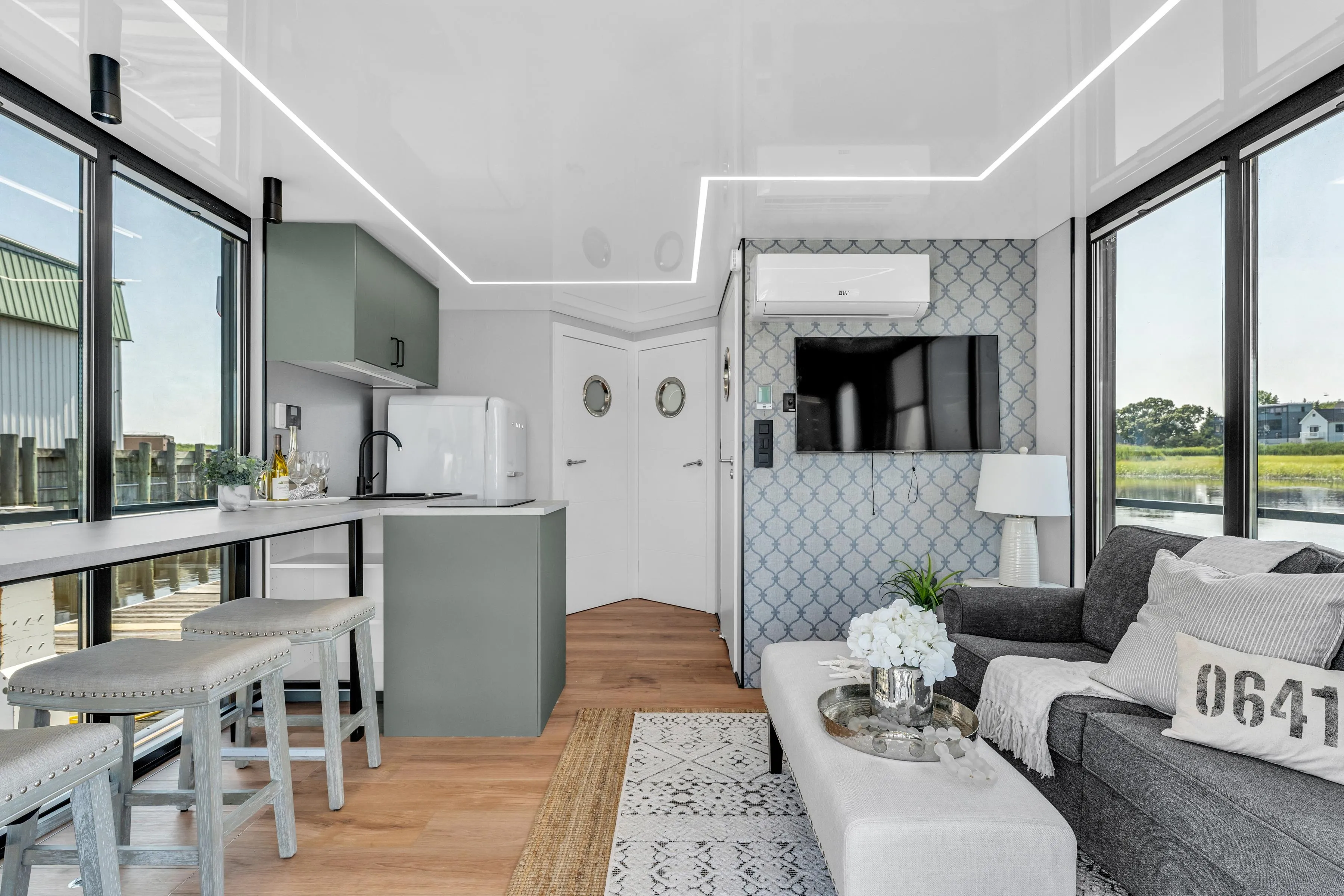 Modern Waterlodge 11 interior, 2025 model, featuring sleek design, cozy seating, and large windows.