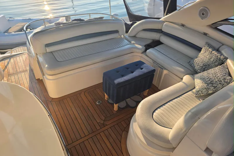 Kings Corner Yacht Photos Pics Luxurious interior of 2001 Sunseeker Camargue 44 yacht with elegant seating and wooden flooring.