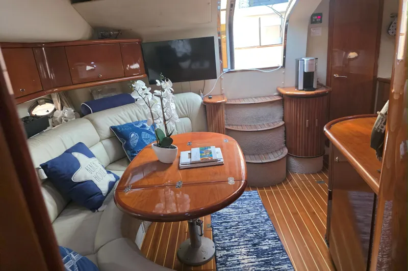 Kings Corner Yacht Photos Pics Luxurious interior of 2001 Sunseeker Camargue 44 yacht with elegant wood finishes.