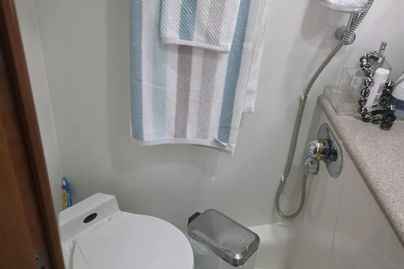 Kings Corner Yacht Photos Pics Bathroom interior of 2001 Sunseeker Camargue 44 yacht with shower and towel.