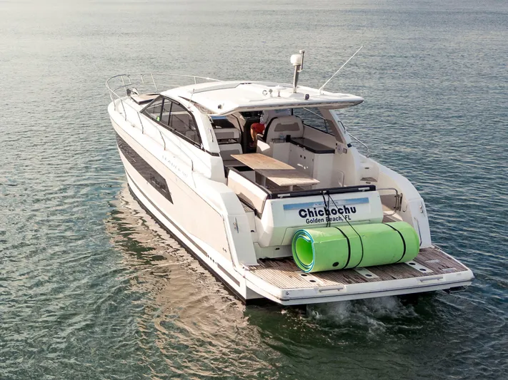 Chichochu Yacht Photos Pics 2017 Jeanneau Leader 40 yacht cruising on calm waters, rear view.