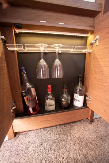 Chichochu Yacht Photos Pics Bar cabinet with glasses and bottles in 2017 Jeanneau Leader 40 yacht.