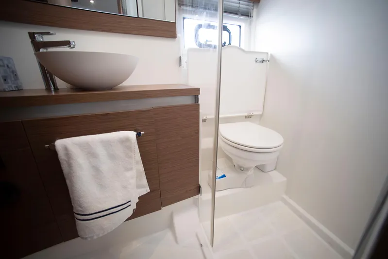 Chichochu Yacht Photos Pics Bathroom interior of 2017 Jeanneau Leader 40 yacht, featuring modern sink and toilet.