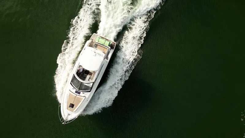 Chichochu Yacht Photos Pics Aerial view of 2018 Jeanneau Leader 40 yacht cruising on open water.