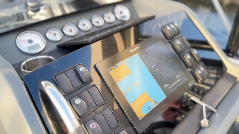 Chichochu Yacht Photos Pics Control panel of 2018 Jeanneau Leader 40 boat with navigation display and gauges.