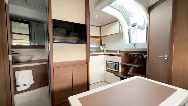 Chichochu Yacht Photos Pics Interior of 2018 Jeanneau Leader 40 yacht with modern kitchen and bathroom.