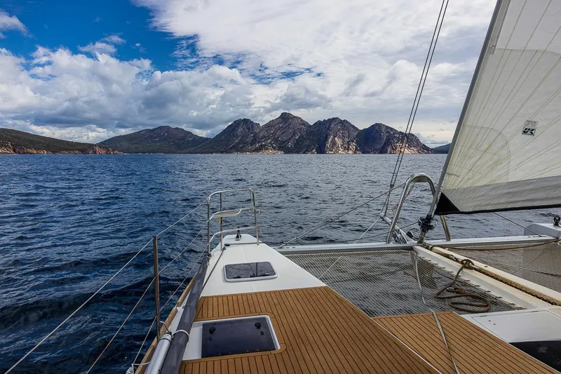  Yacht Photos Pics Sailing on a 2017 Lagoon 52 S catamaran with scenic mountain views.