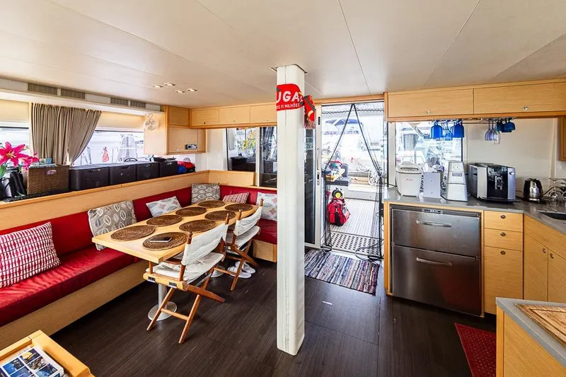  Yacht Photos Pics Interior of 2017 Lagoon 52 S yacht with dining area and kitchen amenities.