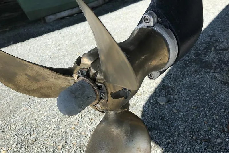  Yacht Photos Pics Close-up of a 2017 Lagoon 52 S boat propeller on gravel surface.