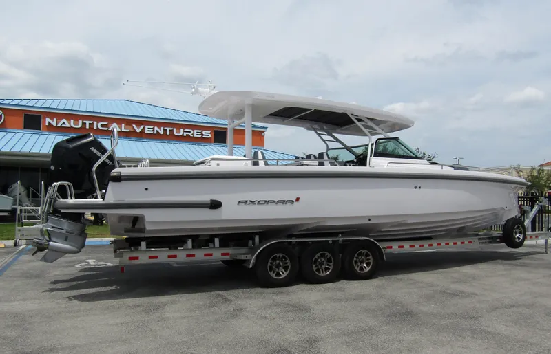  Yacht Photos Pics 2024 Axopar 37 Sun Top boat on trailer at Nautical Ventures dealership.