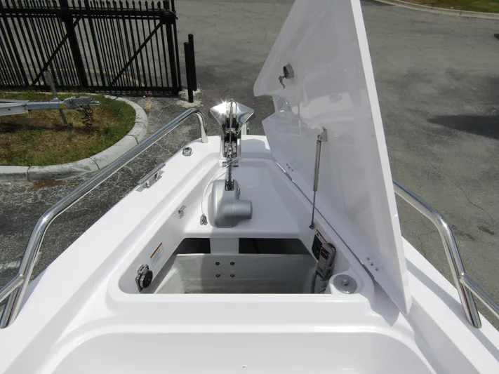  Yacht Photos Pics 2024 Axopar 37 Sun Top anchor compartment with open hatch, showcasing storage and anchor mechanism.
