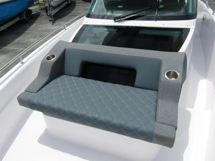  Yacht Photos Pics 2024 Axopar 37 Sun Top boat seating with cup holders and quilted design.