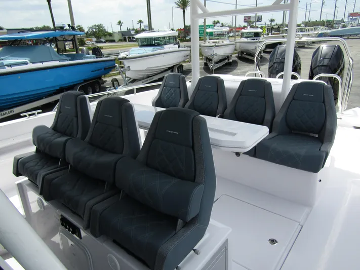  Yacht Photos Pics 2024 Axopar 37 Sun Top boat with luxurious seating and sleek design.