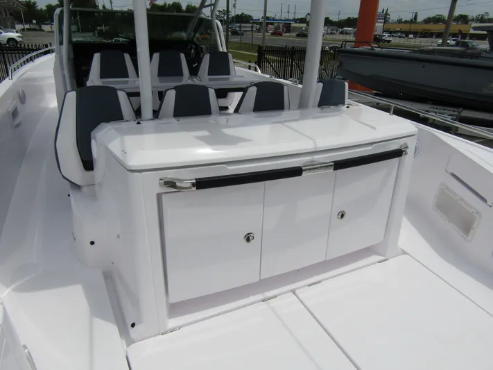  Yacht Photos Pics 2024 Axopar 37 Sun Top boat interior with sleek seating and storage area.