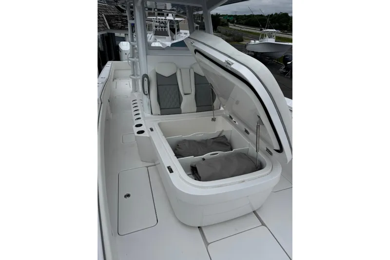  Yacht Photos Pics 2024 Invincible 36 Open Fisherman boat interior with open storage compartment.