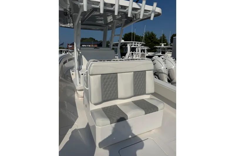  Yacht Photos Pics 2024 Invincible 36 Open Fisherman boat interior with cushioned seating and rod holders.