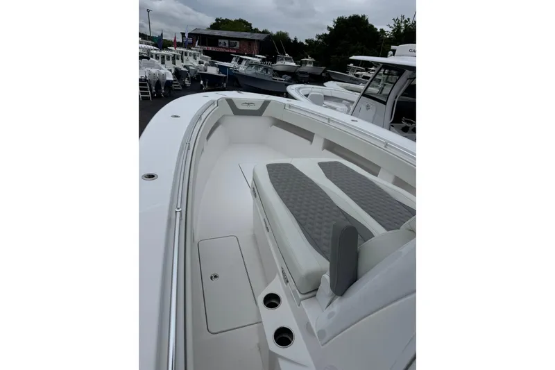  Yacht Photos Pics 2024 Invincible 36 Open Fisherman boat with spacious seating and sleek design.